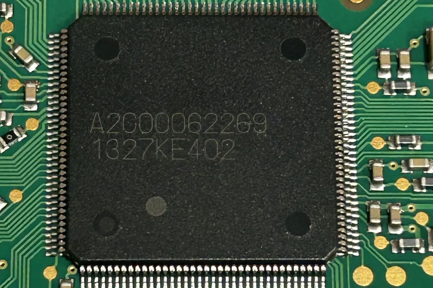 Close-up of the main microcontroller on a Porsche control unit circuit board